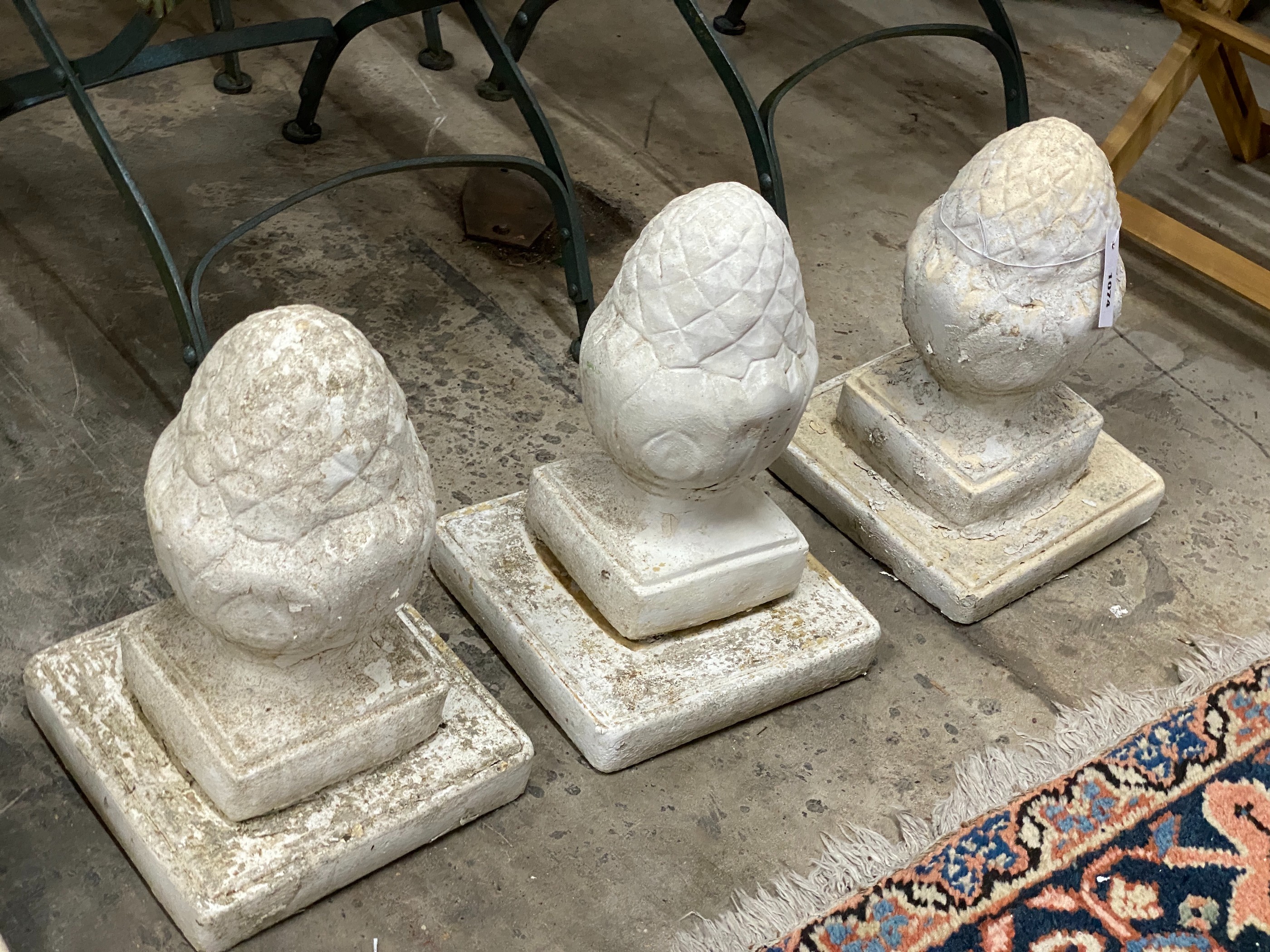 A set of six painted reconstituted stone garden acorn finials, height 36cm